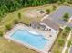 Aerial view featuring a large community pool, lounge area, and ample seating for residents at 4016 Spring Cove Way, Belmont, NC 28012