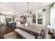 Open-concept dining room flows into the kitchen and living area, featuring a rustic table and bench at 4016 Spring Cove Way, Belmont, NC 28012