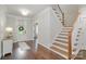 Elegant foyer with hardwood floors, staircase, and a view of the front door creating a warm welcome at 4016 Spring Cove Way, Belmont, NC 28012