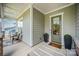 Welcoming front porch featuring a cozy seating area and stylish decor, creating a charming entrance at 4016 Spring Cove Way, Belmont, NC 28012