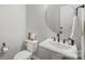 Stylish half bathroom with a pedestal sink, a modern faucet, and ample lighting at 4016 Spring Cove Way, Belmont, NC 28012