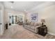 Inviting living room featuring a cozy sofa, accent table, and a view into a second living space at 4016 Spring Cove Way, Belmont, NC 28012