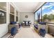 Inviting screened porch with comfortable seating, neutral decor, and a view of the backyard at 4016 Spring Cove Way, Belmont, NC 28012
