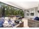 Relaxing screened porch with comfortable seating, and scenic backyard views at 4016 Spring Cove Way, Belmont, NC 28012
