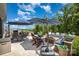 Inviting patio space with comfortable seating, a built-in grill, and lush landscaping at 4016 Spring Cove Way, Belmont, NC 28012