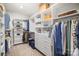 Organized walk-in closet with ample shelving, drawers, and hanging space for clothing at 4016 Spring Cove Way, Belmont, NC 28012