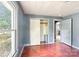 A cozy bedroom with a closet, a window overlooking the backyard, and hardwood floors at 409 Rosemont Ave, Kannapolis, NC 28081
