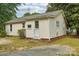 Charming home featuring a white exterior, a front door, and a small front yard at 409 Rosemont Ave, Kannapolis, NC 28081
