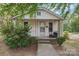 Charming one-story home with vinyl siding, front porch, and manicured landscaping at 409 Rosemont Ave, Kannapolis, NC 28081