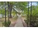 A view of the front yard and sidewalk looking out from the front porch at 409 Rosemont Ave, Kannapolis, NC 28081