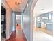 Hallway with arched doorway, hardwood floors, and access to kitchen and other rooms at 409 Rosemont Ave, Kannapolis, NC 28081