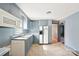 A well-lit kitchen features modern appliances and plenty of cabinet space for storage at 409 Rosemont Ave, Kannapolis, NC 28081