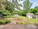 Large backyard with an outbuilding and a lawn at 4325 Wolf Pond Rd, Monroe, NC 28112
