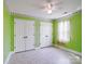 Cozy bedroom featuring colorful walls, two closets, and a window with curtains at 4325 Wolf Pond Rd, Monroe, NC 28112