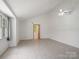 Bright, spacious bedroom with neutral walls, ceiling fan, and natural light at 4325 Wolf Pond Rd, Monroe, NC 28112