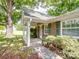 Charming brick home featuring a covered front entrance and lush green landscaping at 4325 Wolf Pond Rd, Monroe, NC 28112