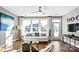 Sun-filled living room with hardwood floors, neutral tones, bright picture window, and modern decor at 4444 Moxie Way, Charlotte, NC 28215