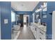 Beautiful primary bathroom with dual vanities, soaking tub, and walk-in closet at 518 Maynard Farm Ln, Stanley, NC 28164
