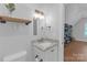 Bathroom vanity with a granite countertop, cabinet, and decorative mirror at 518 Maynard Farm Ln, Stanley, NC 28164