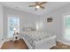 Cozy bedroom with hardwood floors, natural light, and a comfortable bed at 518 Maynard Farm Ln, Stanley, NC 28164