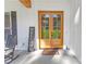 Elegant wooden double doors with glass panels and a charming welcome mat at 518 Maynard Farm Ln, Stanley, NC 28164