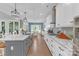 Bright, open kitchen with granite countertops, stainless steel appliances, gas range and a center island with breakfast bar at 518 Maynard Farm Ln, Stanley, NC 28164