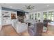 Spacious living room with a stone fireplace, custom built-ins, and stylish decor at 518 Maynard Farm Ln, Stanley, NC 28164