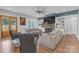 Open-concept living room featuring a cozy fireplace and comfortable seating arrangements at 518 Maynard Farm Ln, Stanley, NC 28164