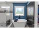 Spa-like main bathroom featuring a freestanding tub, glass enclosed shower, and modern fixtures and design at 518 Maynard Farm Ln, Stanley, NC 28164
