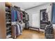 Spacious walk-in closet featuring ample shelving and custom storage solutions at 518 Maynard Farm Ln, Stanley, NC 28164