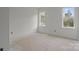 Unfinished room with two windows offering natural light, ready for customization at 522 Herms Ave, Mount Holly, NC 28120