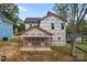 Back exterior view of new home construction with porch and yard at 522 Herms Ave, Mount Holly, NC 28120