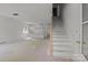 Spacious open-concept area with stairs and a kitchen under construction, ready for customization at 522 Herms Ave, Mount Holly, NC 28120