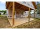 Covered patio under construction featuring double doors and wooden support beams at 522 Herms Ave, Mount Holly, NC 28120