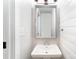 The half bathroom features a pedestal sink, and shiplap walls at 5421 Princess St, Charlotte, NC 28269