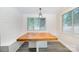 The dining room features a wood table with built-in bench seating at 5421 Princess St, Charlotte, NC 28269