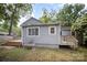 Backyard showcasing the home's exterior and the spacious deck with great outdoor potential at 5421 Princess St, Charlotte, NC 28269