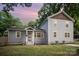 Charming home featuring a well-maintained lawn, gray siding, and a welcoming front entrance at 5421 Princess St, Charlotte, NC 28269