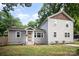 Charming home featuring a well-maintained lawn, gray siding, and a welcoming front entrance at 5421 Princess St, Charlotte, NC 28269