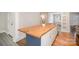Modern kitchen island features a butcher block countertop and stainless steel sink at 5421 Princess St, Charlotte, NC 28269