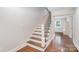 Stylish staircase with wood treads and modern iron railing at 5421 Princess St, Charlotte, NC 28269