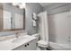 Well-maintained bathroom featuring a vanity sink and shower with a curtain at 5730 Closeburn Rd # H, Charlotte, NC 28210
