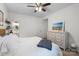 Bright, spacious bedroom with a comfortable bed, dresser and ensuite bathroom access at 5730 Closeburn Rd # H, Charlotte, NC 28210
