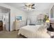 Bright bedroom featuring a comfortable bed, dresser and an ensuite bathroom entrance at 5730 Closeburn Rd # H, Charlotte, NC 28210