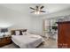 Inviting bedroom with a ceiling fan, bright window and adjacent desk space at 5730 Closeburn Rd # H, Charlotte, NC 28210