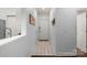 Bright hallway with tile flooring, neutral paint, and a clean aesthetic at 5730 Closeburn Rd # H, Charlotte, NC 28210