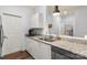 Modern kitchen features granite countertops, white cabinets and stainless steel appliances at 5730 Closeburn Rd # H, Charlotte, NC 28210