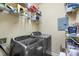 Well-organized laundry room with wire shelving and modern washer and dryer units at 5730 Closeburn Rd # H, Charlotte, NC 28210