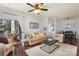 Comfortable living room with a sofa, chairs, and access to an outdoor seating area at 5730 Closeburn Rd # H, Charlotte, NC 28210
