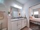 Bathroom with double sinks, granite countertop and decorative mirror at 5918 Barrowlands Ct, Charlotte, NC 28210